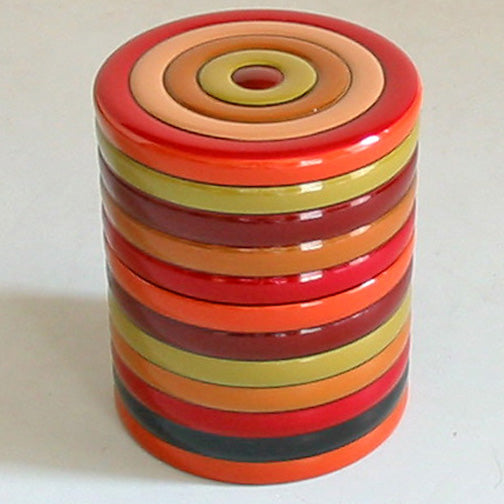 Small wooden tea caddy with spinning top design, lacquered