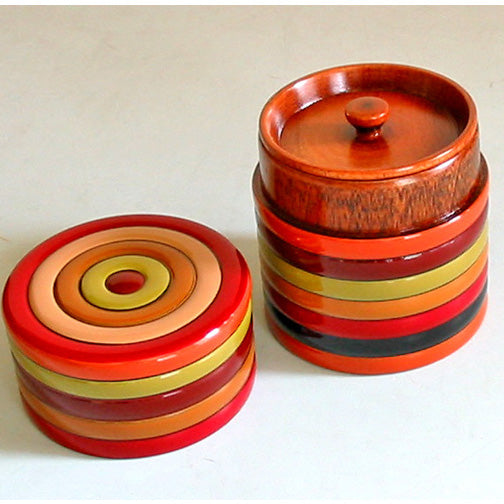 Small wooden tea caddy with spinning top design, lacquered