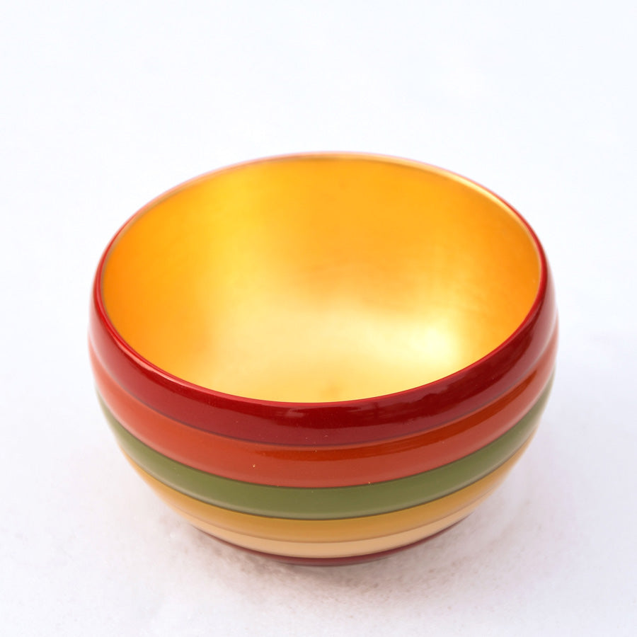Sake cup with spinning top design and gold leaf on the inside, made of wood and lacquered