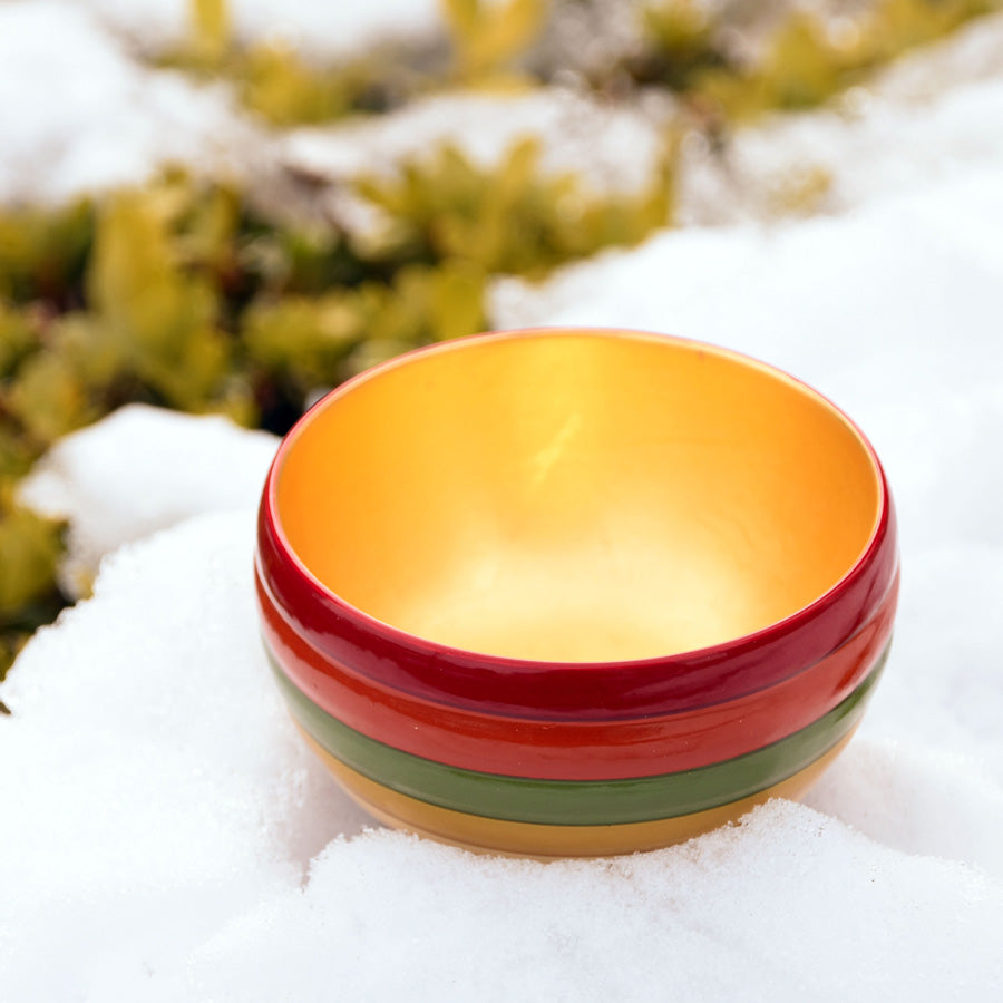 Sake cup with spinning top design and gold leaf on the inside, made of wood and lacquered